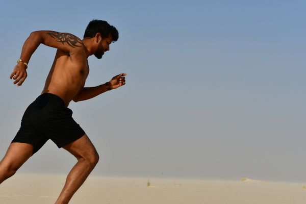 Runner on the sand in desert
