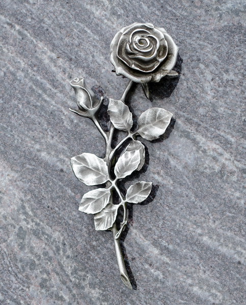 a silver rose on marble