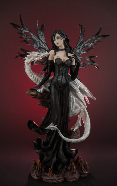 Dark angel with dragon statue