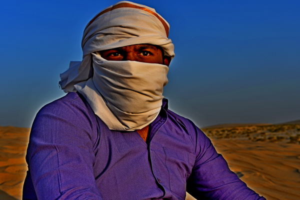 Indian man in the desert sand