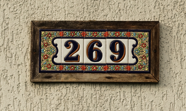 registration numbers in window of wood runabout plate