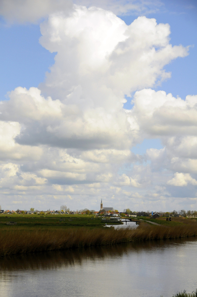 Dutch landscape: typical Dutch Landscape near Amsterdam. The small city on the horizon is called Schermerhorn