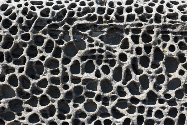 Eroded seawall: Badly eroded seawall in Dorset, England.