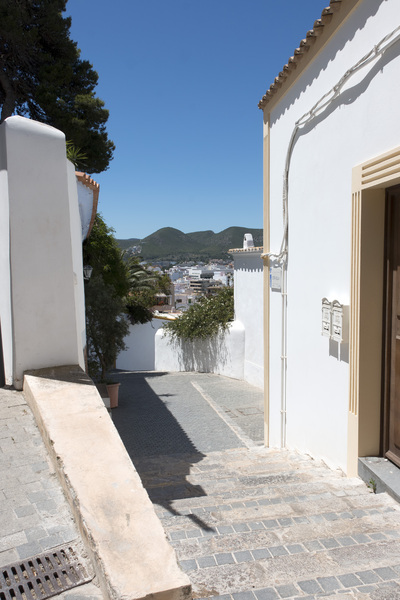Spanish alleyway: An alleyway with a view in Ibiza, Spain.