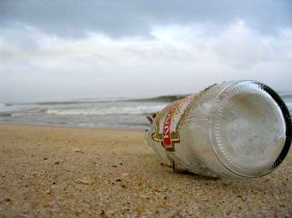 message in the bottle: beer bottle on the beach