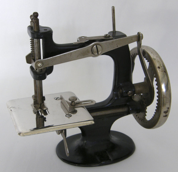 Sewing Machine: Working sewing machine marketed as a toy in the early 1900's.