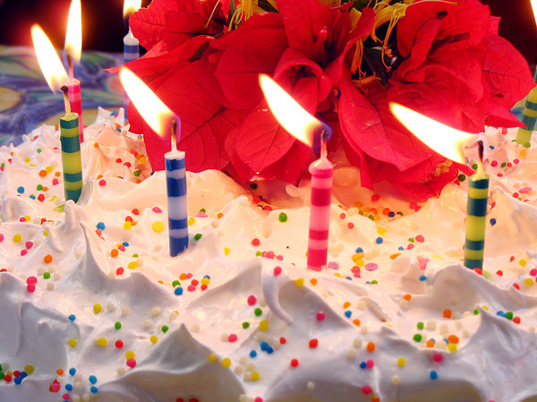 Birthday cake: Birthday cake with colored candles and flower ornaments