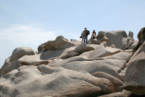 Tourists on sculpted rock