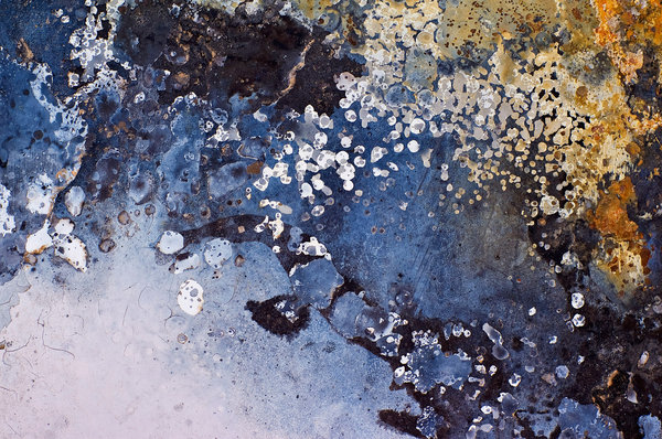 Steel, Paint and Fire: Details of burned paint on the hood (bonnet) of a car.