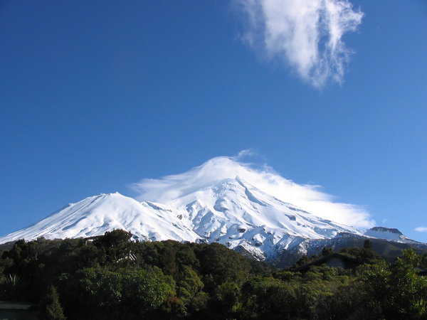 Mountain with mantle: Mount Taranaki (also known as Mount Egmont) on the west coast of the North Island of New Zealand. A mantle of cloud hangs over the summit.