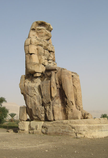 Colossi of Memnon: One of the Colossi of Memnon,Pharaoh Amenhotep Mortuary Temple, Luxor