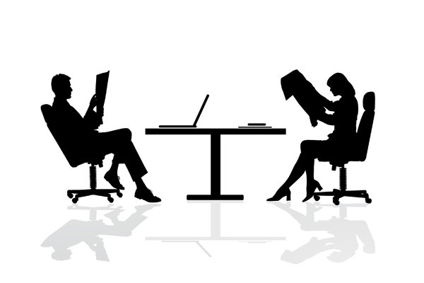 Business Table: Male and female business people at a desk