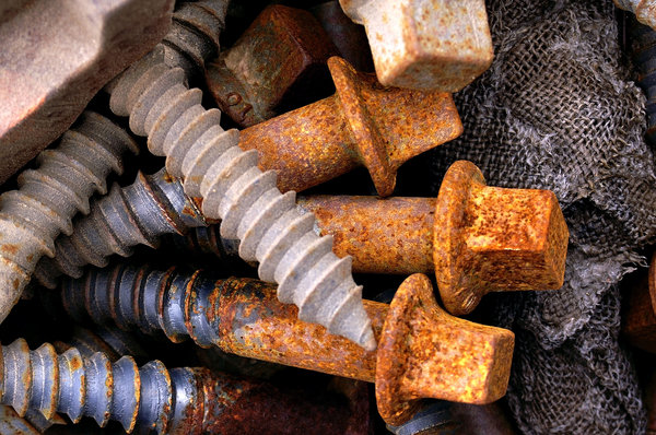 Rusted Bolts/Screws: Rusted bolts or screws found near some railroad tracks.