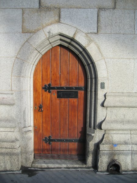 wooden door in stone portal