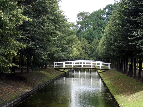 bridge over a channel: lovely architecture - a bridge over a channel for a nice walk in a park