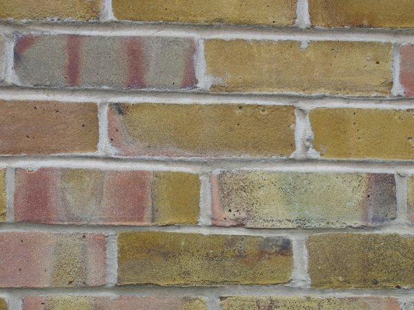 ochre coloured brick wall 2