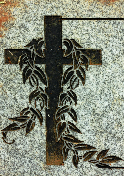 Etched cross on headstone