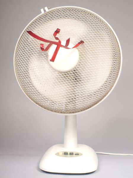 White fan with red ribbons