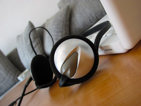 Headphone: headphone on table next to computer