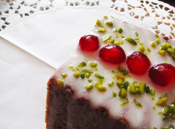iced cake 2: Cake with icing, sugared cherries and pistachios
