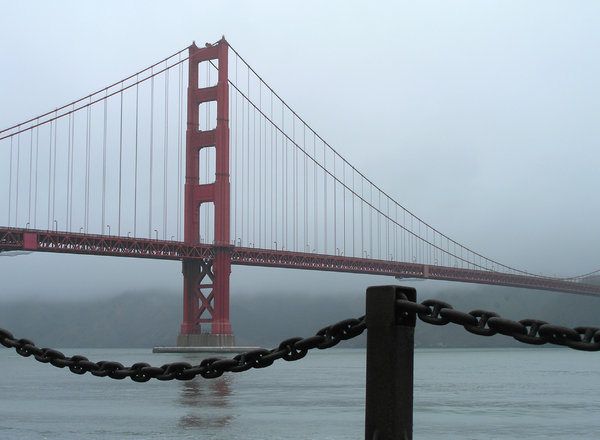 Golden Gate Bridge: Golden Gate Bridge with sailboats on a misty day in San Francisco