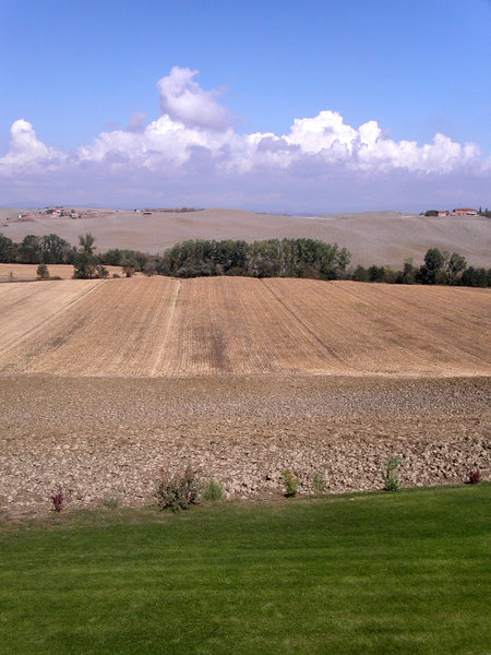 tuscany fields and clouds
