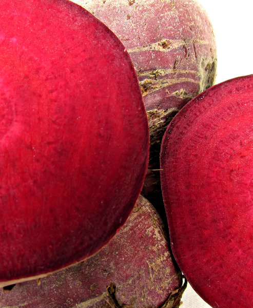 beetroot: raw uncooked beetroot showing cut halves