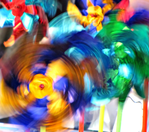swirling colour: spinning colorful toy wind wheels