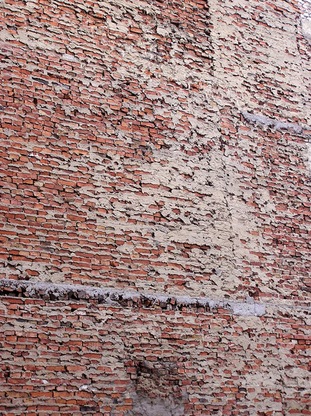 Brick wall: A wall of a building in Praga, Warsaw.