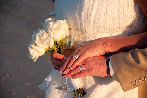 Wedding Accents: Champagne, new rings and the bouquet from a winter wedding on the beach