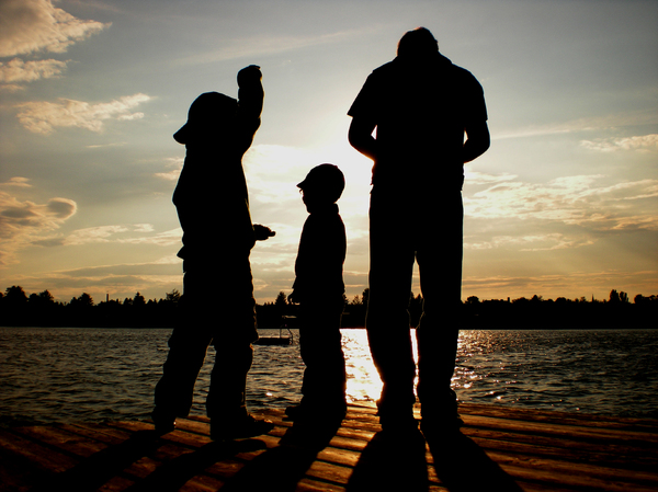 silhouettes on the lake: silhouettes of my family on our holiday in Burgenland (Austria)