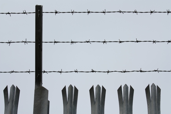 Barbed wire fence top