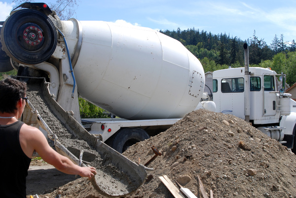 Construction Worker: Construction crew pouring concrete