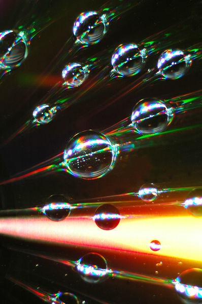 Burst of light: Water drops on CD