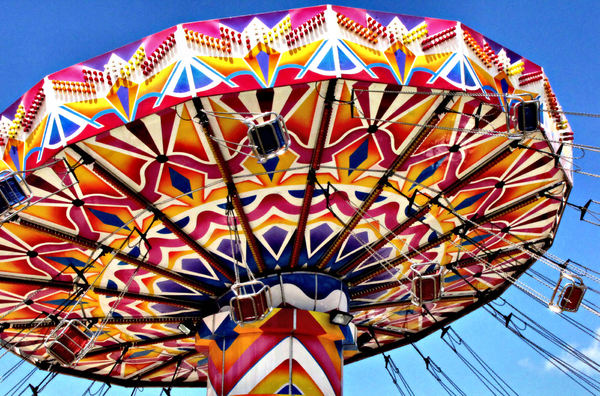 around in circles8b: colourful rotating fairground rides