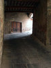 Dark pathway: an old stony-tunnel in montepulciano, italy