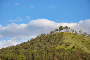 Green hill: Green hill and blue sky with clouds