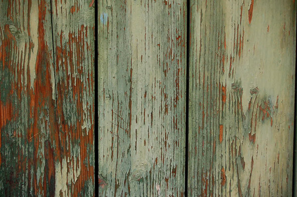 Wood door texture: Green painted wooden door with cracked painting.
