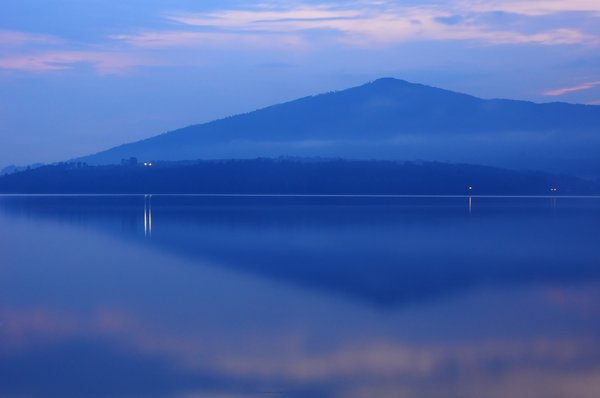 Lake at dusk: Mountain reflected on lake at dusk