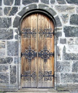 medieval wooden door: medieval wooden door on the Mariakirken, the oldest building in Bergen, Norway. Built 1140-70, restored 1853-75