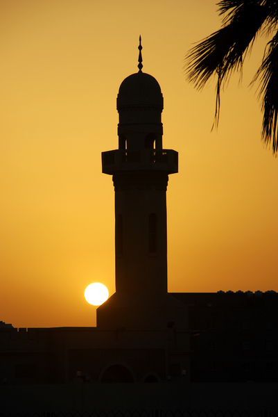 Minaret at Sunset 2: A minaret and palm tree silhouetted at sunset