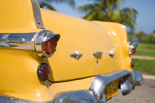 Yellow Cuban classic car: Backside of a Cuban classic car