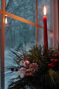 Christmas_candle_in_window-05b: Red Christmas candle in paned window in winter.