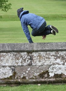 The getaway?: Teen boy leaping a wall