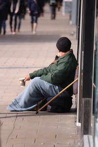 Homeless Man: A homeless man begging on the street
