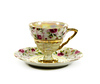 Tea Cup and Saucer: Elegant hand painted China with gold trim and pearl paint inside the cup and on the stem