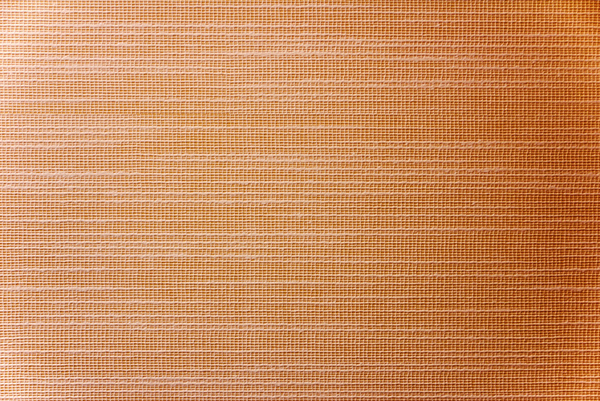 Textured Wallpaper: Lacy wallpaper freshly applied to a yellow wall to give the wall some texture.