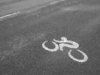 Bike lane: Quite unusual signalling icon painted on a stretch of road reserved for cycling. Picture taken at República de los Niños public park, Gonnet, La Plata, Argentina.