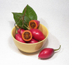 Tamarillos 3: Home-grown tree tomatos (aka tamarillos) in a yellow bowl. (The leaves are tomato tree's as well).