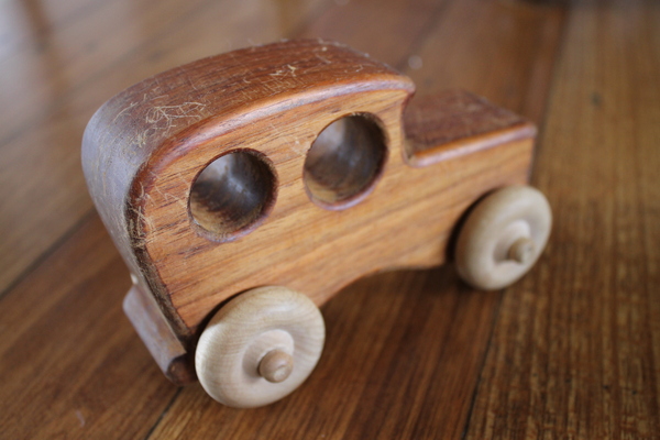 Wooden Toy 2: Wood car toy on a wooden floor.